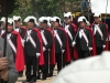 White plumes and red-caped knights with swords drawn