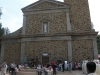 The plaza of the shrine and its facade with the bronze statue of Juan Diego and Bish. Zummaraga in front.