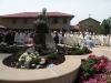 Statue of Juan Diego with the Marian Catechetical Center and our new friary in the background and many bishops.